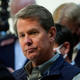 Georgia Gov. Brian Kemp listens to a question during a news conference at the State Capitol on Saturday, April 3, 2021, in Atlanta, about Major League Baseball’s decision to pull the 2021 All-Star Game from Atlanta over the league’s objection to a new Georgia voting law.